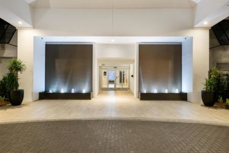 Brown Copper Painted Scored Acrylic Aquafalls with Reflection Pool Basin and Bubbler Jets at Beachcomber Resort Club in Pompano Beach Florida